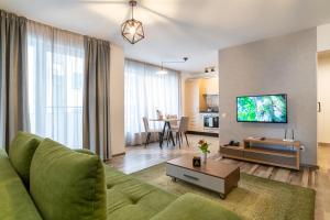 TCI Apartments tesisinde bir televizyon ve/veya eğlence merkezi