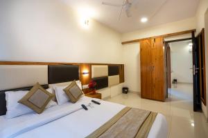 Krevet ili kreveti u jedinici u objektu Home2 Suites and Service Apartments, Mumbai Airport