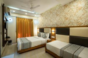 Krevet ili kreveti u jedinici u objektu Home2 Suites and Service Apartments, Mumbai Airport