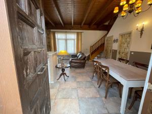 a living room with a table and a couch at A03 - Casita Minibú Anciles - Villmor in Anciles