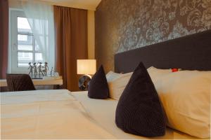 Cama ou camas em um quarto em Landhotel Zum Kronprinzen