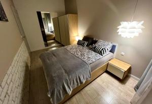 Una cama o camas en una habitación de Apartament Byka