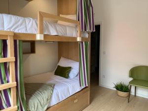 A bed or beds in a room at Lost Inn Porto Hostel