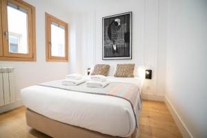 Krevet ili kreveti u jedinici u okviru objekta Smartr Madrid Gran Via Apartments