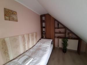 Voodi või voodid majutusasutuse Egniss Apartman toas