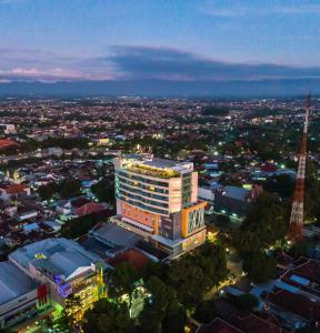 a view of a city with a tall building at THE 1O1 Malang OJ in Malang