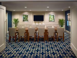 a conference room with a long table and chairs at Sonesta ES Suites Chicago - Schaumburg in Schaumburg