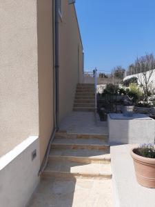 a stairway leading up to a building with some stairs at Apartmani NIKA in Dubrovnik