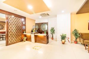 a lobby of a hospital with a reception desk at Octave Himalaya Monarch in Bangalore