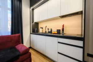 A kitchen or kitchenette at KarPatti Apartment