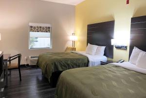 Tempat tidur dalam kamar di Wingate by Wyndham Biloxi - Ocean Springs