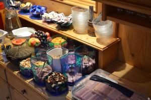 a cabinet filled with different types of food at Gästehaus Troppmair in Finkenberg