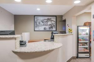 a store with a counter and a refrigerator at Super 8 by Wyndham Boise in Boise