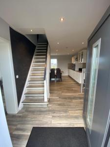 a hallway with a staircase in a house at Design Apartment Sasaki in Celle