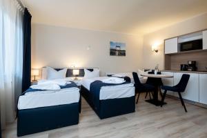 Aparthotel Stralsund Studios und Apartments 객실 침대