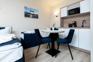 Aparthotel Stralsund Studios und Apartments 주방 또는 간이 주방