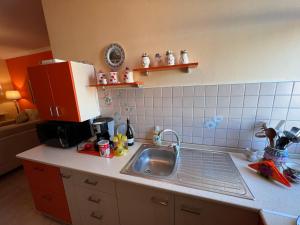 a kitchen with a sink and a counter top at City Center Apartment in Shkoder in Shkodër