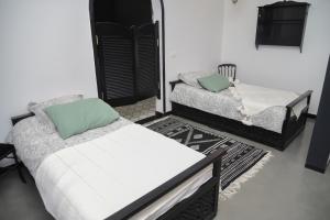 A bed or beds in a room at Dar Yomma