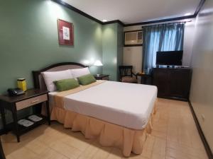 Lova arba lovos apgyvendinimo įstaigoje Tagaytay Country Hotel