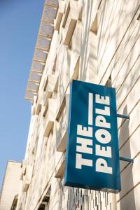 a sign for a hotel in front of a building at The People - Tours in Tours