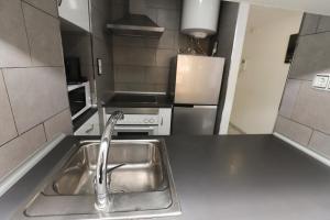 A cozinha ou cozinha compacta de DIFFERENTFLATS Cancun