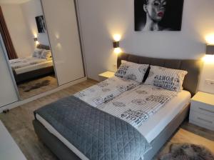 Cama ou camas em um quarto em Armony Apartament Timisoara