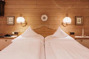 Cama ou camas em um quarto em Alpenhotel Heimspitze