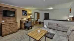 Uma TV ou centro de entretenimento em Alpenhotel Fischer 4 Sterne - Adults Only