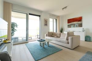 A seating area at Les Terrasses de Lavaux 1 - Appartement de luxe avec vue panoramique et piscine