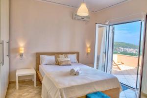 A bed or beds in a room at Epidavros Land villa Elia