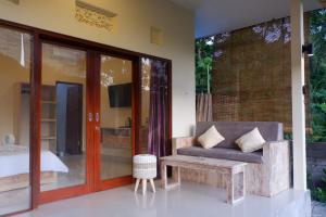 A bed or beds in a room at Abian Dauh Sidemen