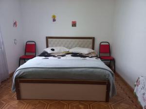 A bed or beds in a room at Сибиряк