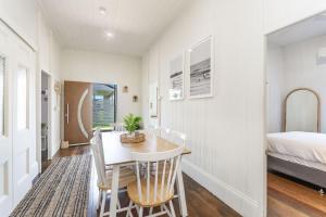 A bed or beds in a room at High Three - Downtown Beach House