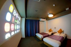 a hotel room with two beds and a large window at Hotel S-Presso West - Vacation STAY 9085 in Osaka