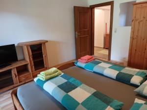 Кровать или кровати в номере Apartment Lochner Piesendorf-Walchen