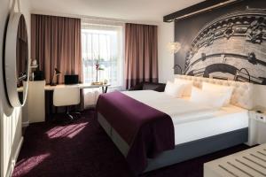 Кровать или кровати в номере Dorint Kongresshotel Mannheim