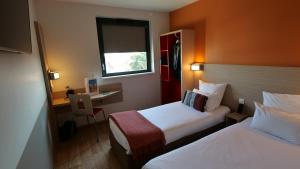 Cama ou camas em um quarto em Oneloft Hotel