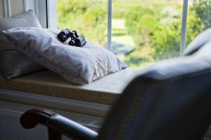 A bed or beds in a room at Coed Mawr Hall Bed & Breakfast