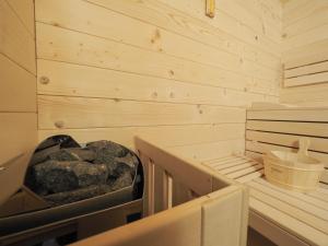 a sauna with a pile of rocks in it at Hotel Anastasia in Sibiu