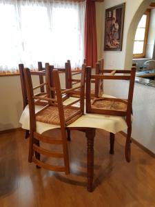 a group of chairs sitting around a table at Imseng in Wiler