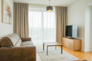 טלויזיה ו/או מרכז בידור ב-Nadland Apartments B61