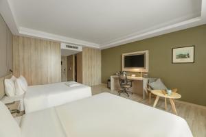 Ένα ή περισσότερα κρεβάτια σε δωμάτιο στο Atour Hotel Xian Greater Wild Goose Pagoda