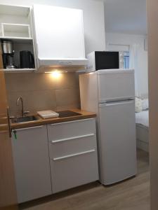 A cozinha ou cozinha compacta de Charming apartments Duce