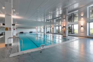 a large swimming pool in a large building at The Sands Torquay in Torquay