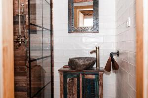 a bathroom with a sink and a mirror at PARKHOUSE in Rožňava