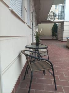 A balcony or terrace at CAPPUCCINO CENTRUM Apartman