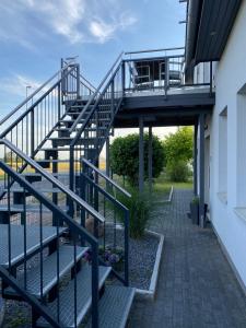 a set of stairs leading up to a building at Design Apartment Sasaki in Celle