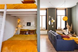 a bedroom with a bunk bed and a couch at Cosy Nock ! Little Gem at City Center with Large Terrace ! in Breda