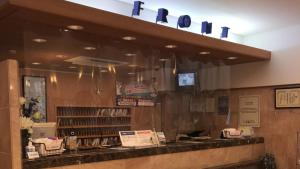 a fast food restaurant with a sign above a counter at Toyoko Inn Ichinoseki Ekimae in Ichinoseki