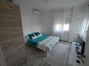 Katil atau katil-katil dalam bilik di Apartman Magdalena